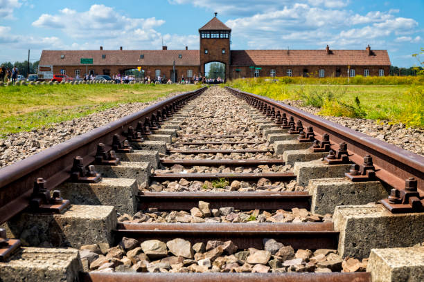 Auschwitz - Birkenau, Poland - August 11, 2019:The railroad tracks leading to Birkenau concentration camp where people from all over Europe were brought, Auschwitz - Birkenau concentration camp, Poland