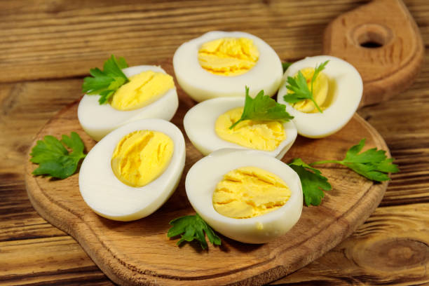 istock Boiled eggs with parsley on cutting board on a wooden table 1177872442
