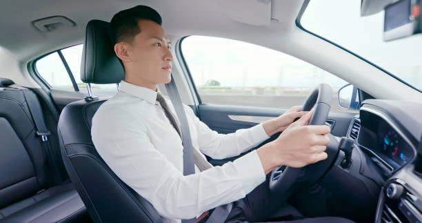 istock business asian man driving car 1177873352