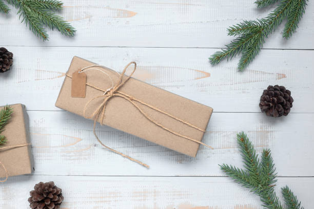 istock Christmas decoration, gift box and pine tree branches on wooden background, preparation for holiday concept, Happy New Year and Xmas Holidays. Top view and Copy Space for text 1177873627