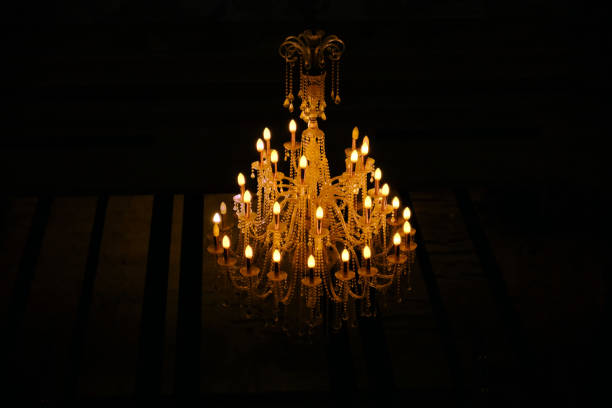 istock Large crystal chandelier on dark background 1177875193