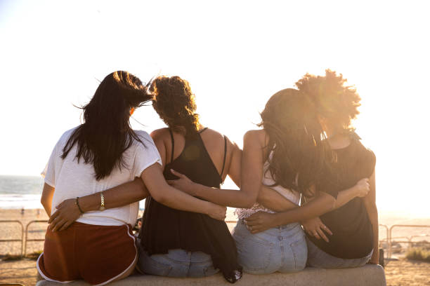 istock Happy young women having fun on the beach 1177875559