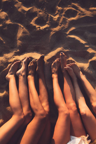 istock Happy young women having fun on the beach 1177875628