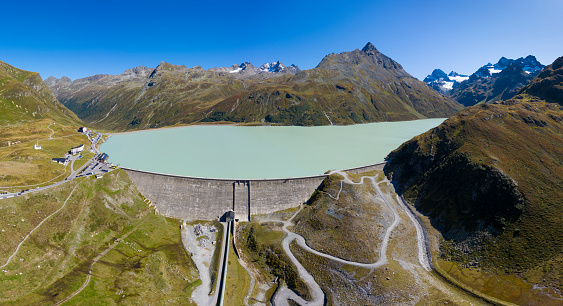 Aerial view from the Silvretta reservoir and the Silvretta Alps in Vorarlberg, Austria. HDR panorama with extremely high resolution shot by a drone.
