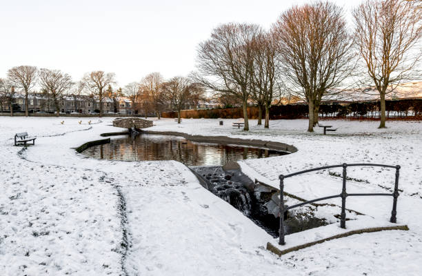 istock A small artificial pond and river in Westburn park during winter season 1177878760