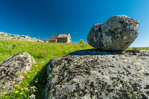 Stone and granite rock near a house on the Aubrac plateau
