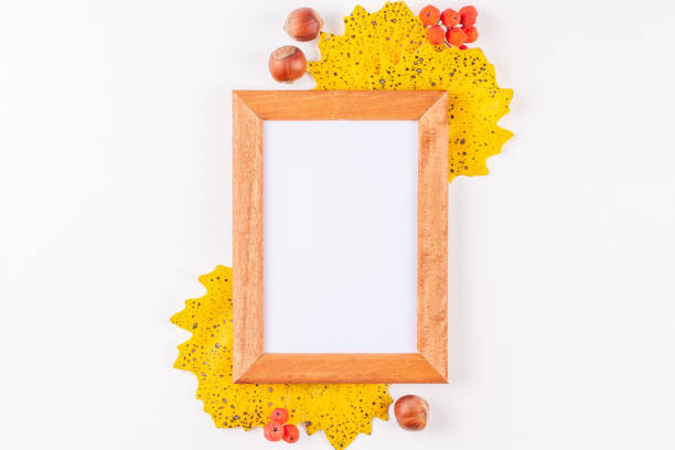istock Autumn style photo frame with copy space surrounded yellow leaves, rowan berries 1177878939