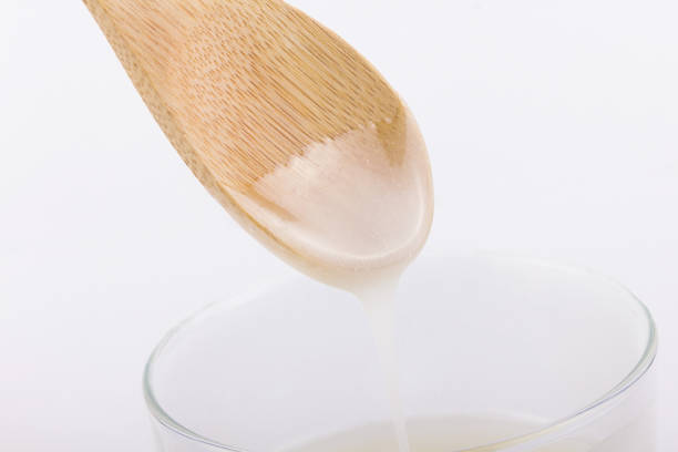 istock Inverted sugar syrup pouring from a spoon 1177879336
