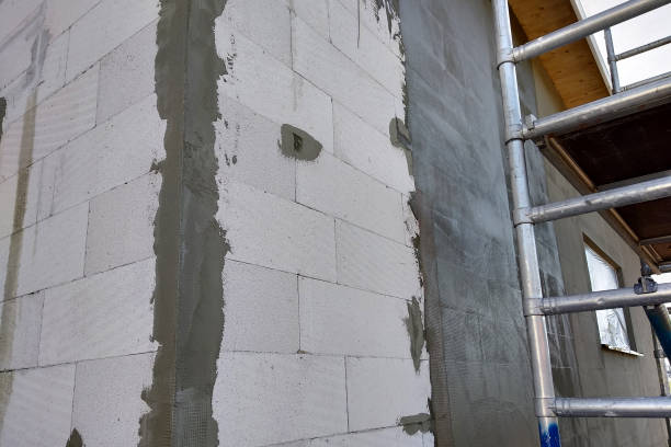 istock Facade of white block building under construction works. 1177882388
