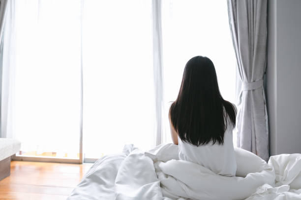 istock Woman wake up in bed 1177884835