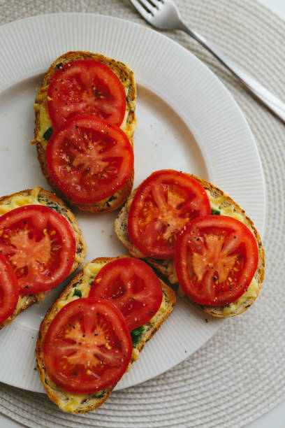 istock Open faced tomato and cheese sandwiches 1177884889