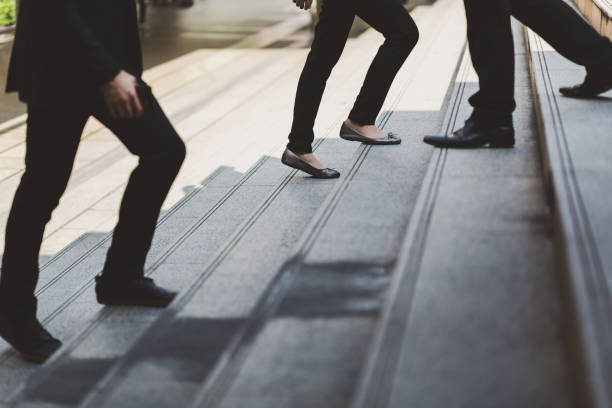 istock Business people walking upstairs 1177885320