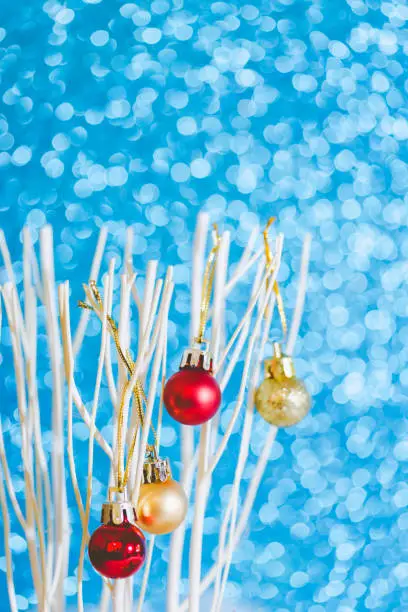 Christmas decoration with gold and red ball and blue glitter paper background on snow, vintage style