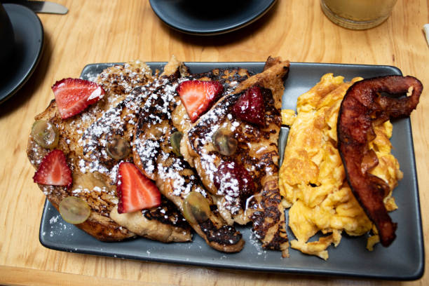 istock French toast and scramble eggs for breakfrast, 1177890501