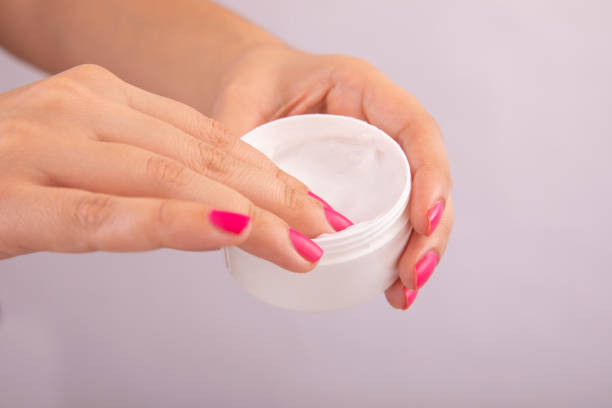 istock Cosmetic Cream with Fingers Photo 1177891164