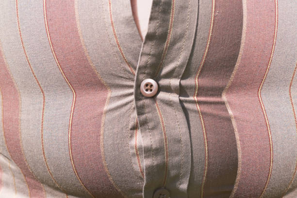 istock Fastened shirt over a fat stomach 1177892457