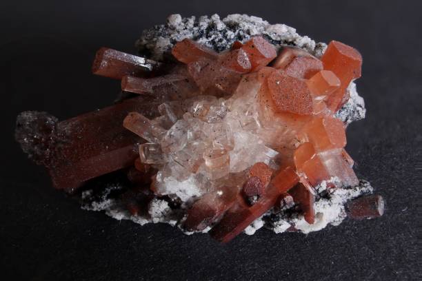 istock Orange and clear topaz on stone matrix with small crystals 1177892667