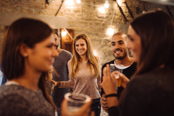 istock friends talking together at the party 1177893706