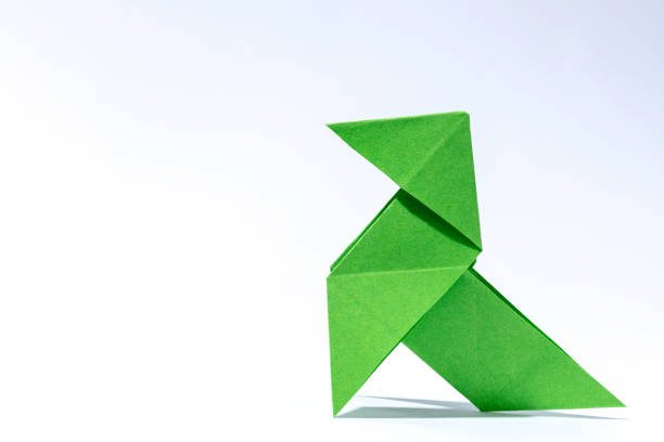 classic green paper bird origami with free space for text on the left side, high cartoon texture and big size