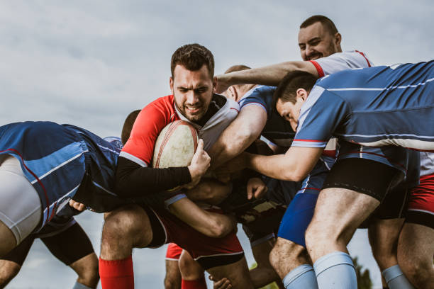 istock Rugby players blocking their opponent on a match at playing field. 1177895767