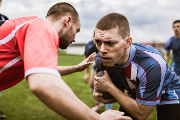 istock Young athlete making an effort during rugby match on playing field. 1177895890