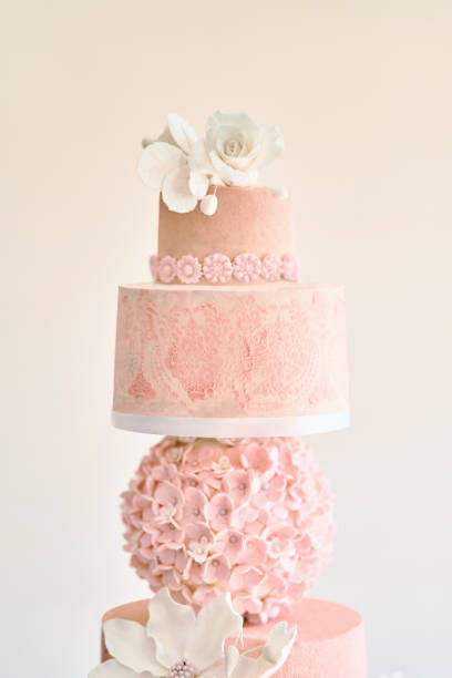 istock Big layered cake show. Pink cake with white roses 1177897394
