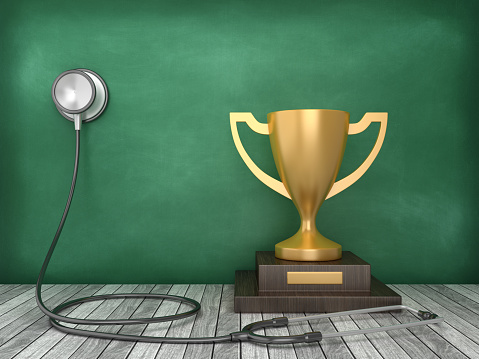 Stethoscope with Trophy on Chalkboard Background - 3D Rendering
