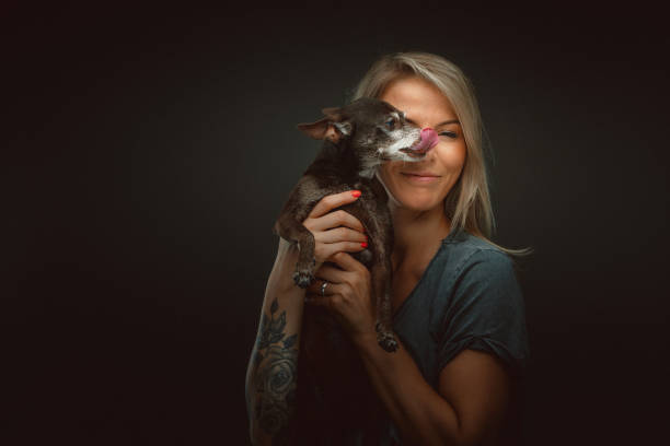 istock Young pretty woman with her dog 1177898883
