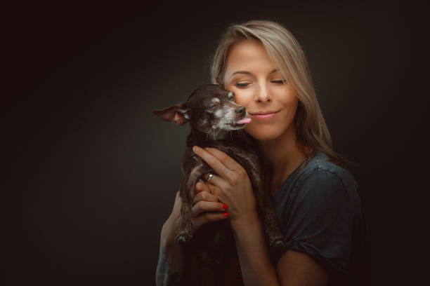 istock Young pretty woman with her dog 1177898905