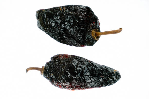 istock Isolated smoked dried pepper, Chile Ancho, or dried Poblano pepper, Capsicum annuum, on a white background 1177903922