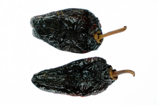 istock Isolated smoked dried pepper, Chile Ancho, or dried Poblano pepper, Capsicum annuum, on a white background 1177904976