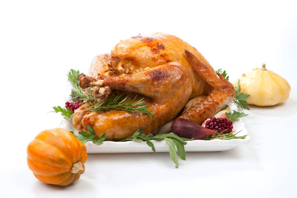 istock Traditional Roasted Turkey on White With Pumpkin 1177905120