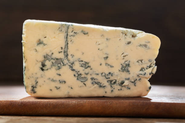 istock blue cheese on wooden board 1177905154