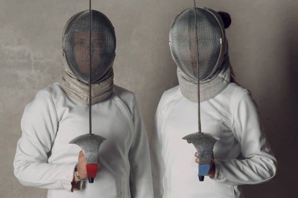 istock Fencer women with fencing sword. 1177906066
