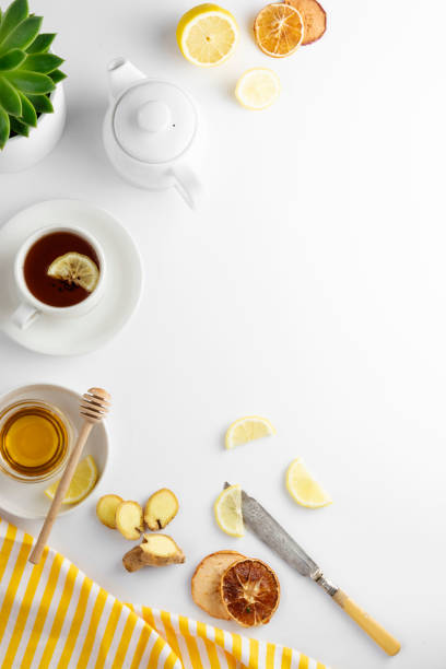 istock Ginger tea with lemon honey hot autumn, winter drink white background with copy space flat lay. 1177906076