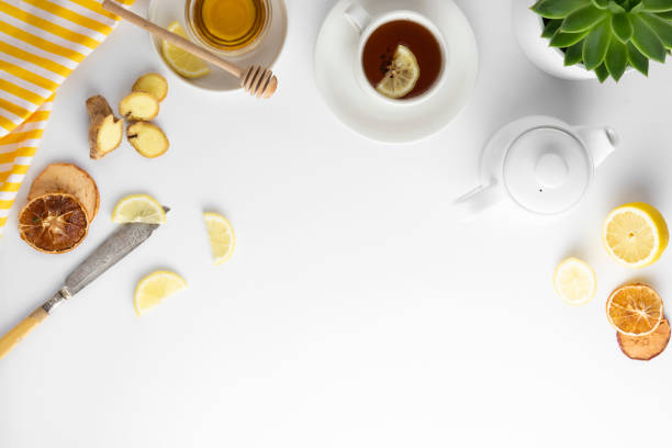 istock Ginger tea with lemon honey hot autumn, winter drink white background with copy space flat lay. 1177906247
