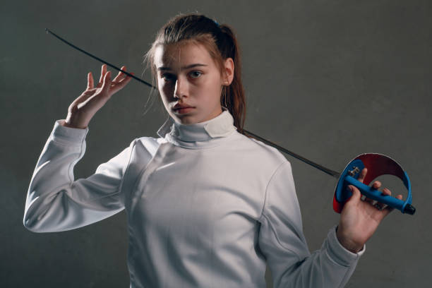 istock Fencer woman with fencing sword. 1177906699