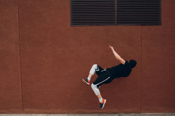 istock Parkour young man making acrobatic trick and flip jumping high 1177908790