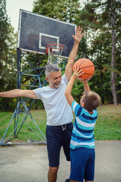 istock Father and son playing basketball 1177908910