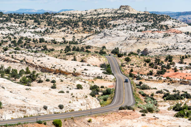 High angle view of highway 12 scenic byway with car on winding road in Grand Staircase Escalante National Monument in Utah High angle view of highway 12 scenic byway with car on winding road in Grand Staircase Escalante National Monument in Utah escalante stock pictures, royalty-free photos & images