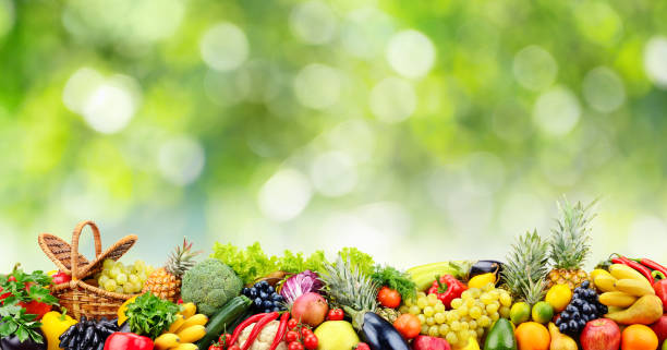 istock Fruits, vegetables, berries on green natural blurred background. 1177910737