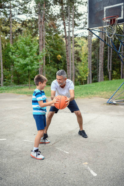 istock Father and son playing basketball 1177911815