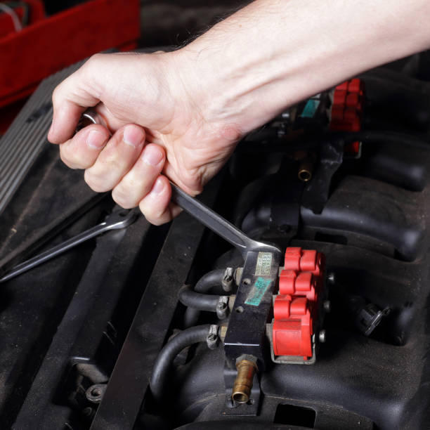 istock Car service - Engine repair mechanic hand with wrench. 1177913059