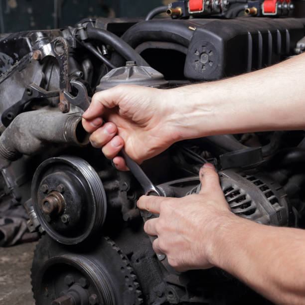 istock Car service - Engine repair mechanic hands with wrench generator nut 1177913121