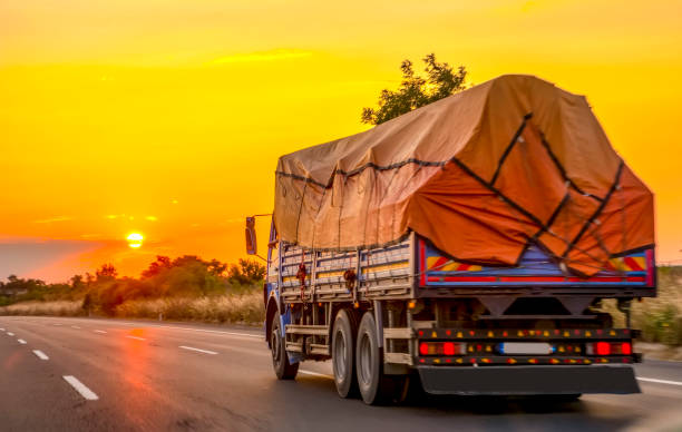 istock Truck with container on highway, cargo transportation concept. 1177915093