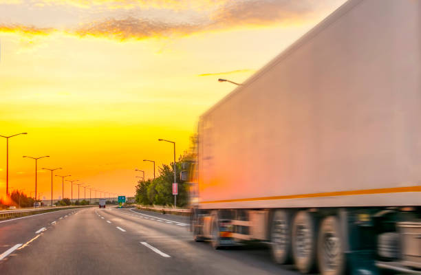 istock Truck with container on highway, cargo transportation concept. 1177915758