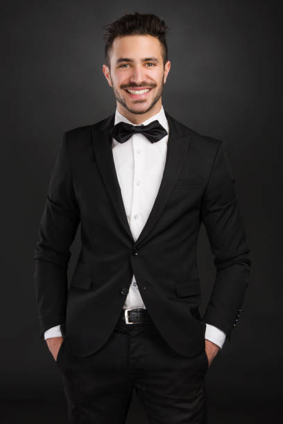 Portrait of a beautiful latin man smiling wearing a tuxedo