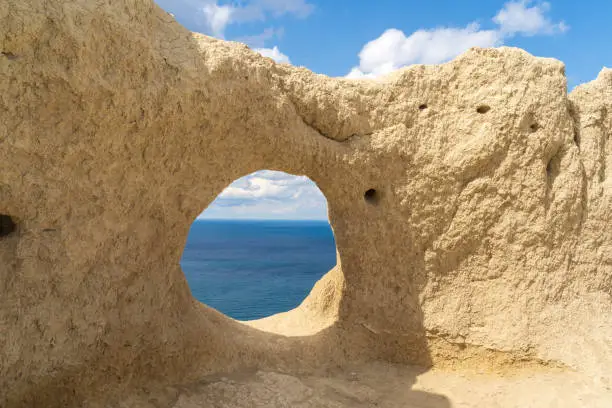 View through the round rock with swallow's nests to the Black sea, in Anapa, Russia.