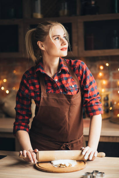 istock Woman rolling gingerbread dough with rolling pin 1177917667