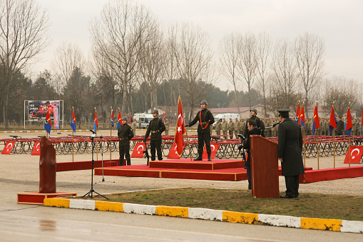 Kastamonu 12.01.2018 turkish soldiers in camouflage at ceremony in front of turkish flag